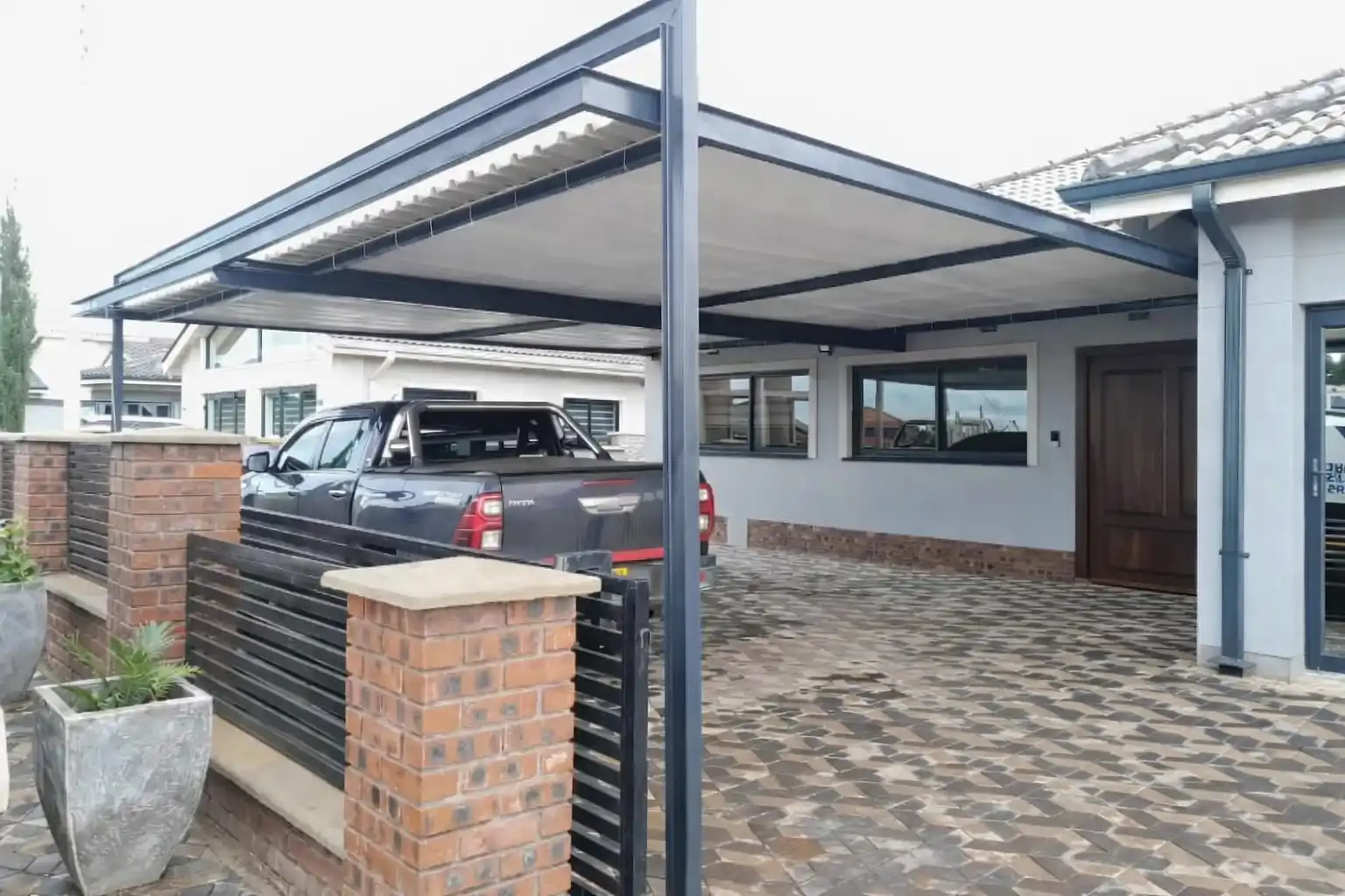Modern steel carport installation
